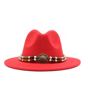 Detail of red wool felt fedora with bohemian beaded band and vintage metal buckle