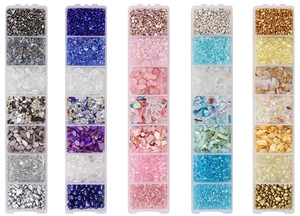 Macro view of 7-grid boxes with colorful AB glass shards and DIY nail art accessories