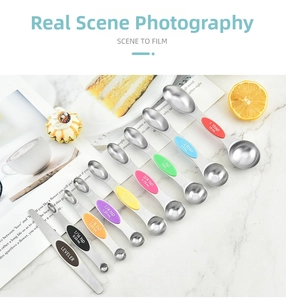 Macro detail of 9-piece stainless steel measuring spoons with colorful silicone grips