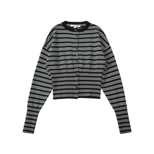 Detailed close-up of a black and white striped knit cardigan with fine front buttoning