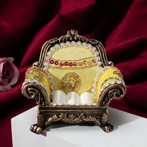European vintage miniature sofa jewelry stand with yellow fabric and red crystal accents