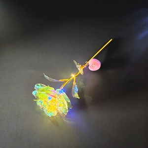 24K gold foil rose with colorful LED light and gold stem on dark background