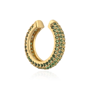 Macro shot of gold-plated U-shaped ear cuff with pave-set green cubic zirconia stones