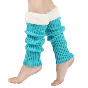 Detailed knit texture of teal winter leg warmers with soft white faux fur trim detail