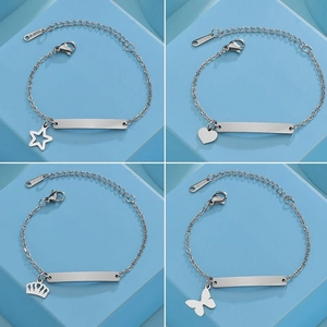 Detail of four stainless steel bracelets with star heart crown and butterfly charms