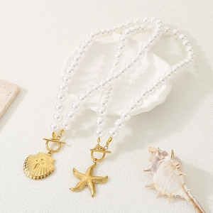 French vintage pearl chain bracelet with gold shell and starfish heart pendants
