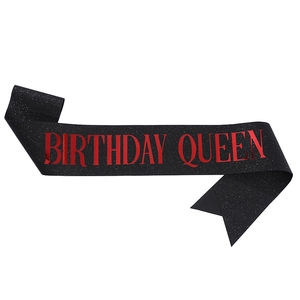 Sparkling black fabric sash with red Birthday Queen text for birthday party decoration