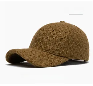 Detailed close-up of coffee brown knit baseball cap featuring a premium diamond weave pattern