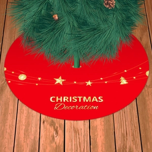 Red Christmas tree skirt with golden star patterns and beaded holiday decoration on wood floor