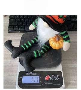 Detailed view of striped Halloween gnome plush decoration showing 117g product weight