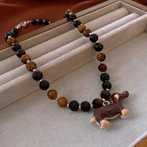Tiger eye and black onyx beaded necklace with a brown dachshund puppy dog pendant