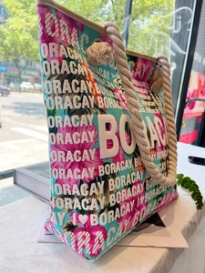 Close-up of tropical floral canvas tote bag with rope handle and Boracay embroidery