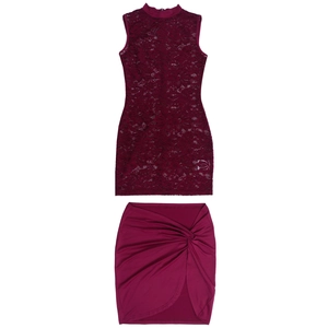 Detail of burgundy lace sleeveless top and ruched skirt set on white background