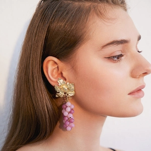 French style purple grape cluster earrings with golden leaf design on female model