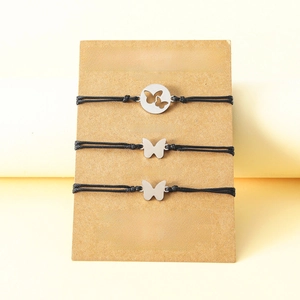 Three-piece sun and moon friendship bracelets on a kraft display card with heart details