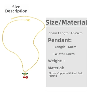 Detail view of gold cherry necklace with dimensions 1.8x1.8cm and 45+5cm chain length