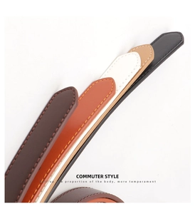 Detail showing five colors of slim PU leather belts with fine contrast stitching