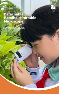 Kid using white portable handheld microscope for outdoor scientific leaf observation