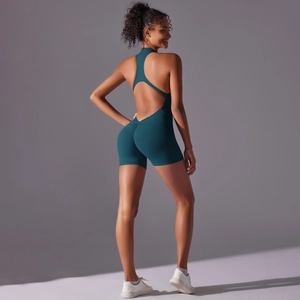 Macro view of teal gym bodysuit featuring open back cutout and scrunch butt detailing