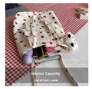 Large capacity strawberry corduroy tote bag showing interior storage for daily essentials