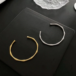Minimalist bamboo joint open cuff bangle for women in elegant gold and silver finishes