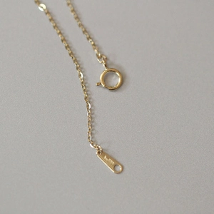 Detail of 14k gold plated 925 silver chain with spring clasp and Au750 hallmark tag