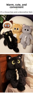 Detail of plush cat tissue box covers in black, orange, grey, and white colors