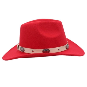 Detail of red cowboy hat featuring beige leather belt with floral silver buckles