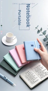 Detailed view of portable A7 mini notebooks with thick paper and elastic strap closure