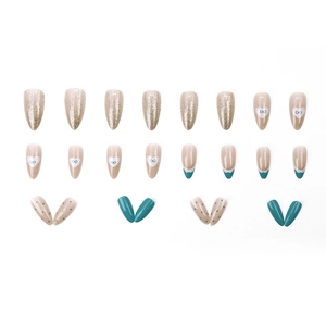 French tip press-on nails set with heart patterns and glitter finish on white background
