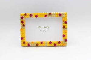 Detail of DIY building block photo frame 4x6 inch with yellow starry decorative elements