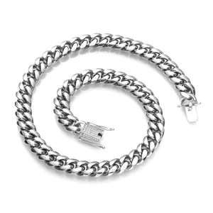Men's 12mm silver Cuban link necklace with iced out rhinestone buckle on white background
