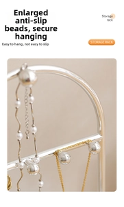 Close-up of silver jewelry stand featuring large non-slip beads and hanging necklaces