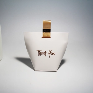 Elegant white trapezoid gift box with gold ribbon handle and Thank You gold stamping