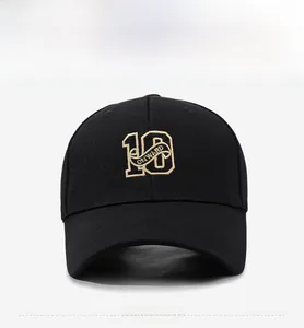 Front detail of black baseball cap with golden embroidery 10 and Onward text