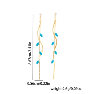 Detail showing gold leaf tassel earrings dimensions: 8.67cm length and 0.56cm width