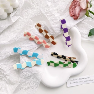 Set of 6 wavy checkered candy-colored hair clips in various vibrant resin patterns