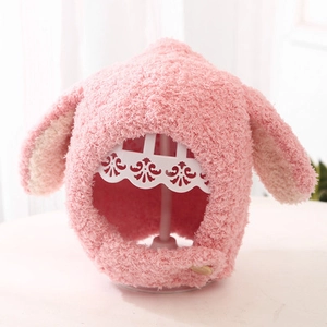 Pink plush baby winter hat with cute rabbit ears and chin strap button for warmth