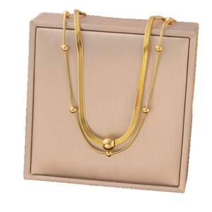 Double-layered gold titanium steel necklace with herringbone chain and round beads