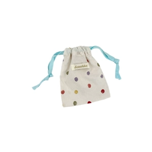 Drawstring pouch with colorful polka dots on off-white linen for small items storage