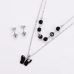 Detail of silver necklace with black butterfly pendant and evil eye bead charms set