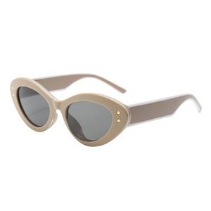 Retro cat-eye sunglasses with oval beige frames, grey lenses and gold star details