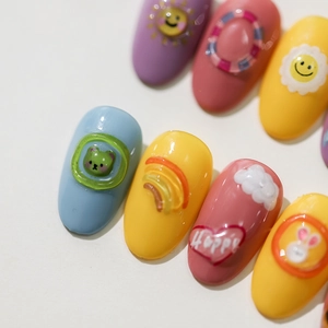 Colorful 3D cartoon nail charms with rainbows, hearts, and bears for cute nail art