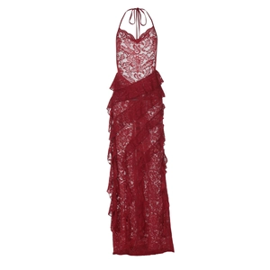 Detailed view of red lace fabric with ruffled tiers and halter neckline on maxi dress