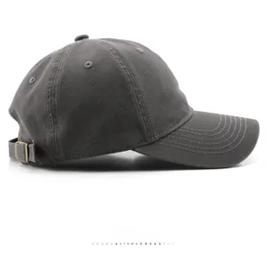 Side view of dark gray washed cotton baseball cap with adjustable metal buckle and stitching