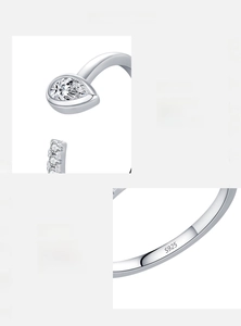 Macro detail of S925 sterling silver stamp and hand-set 5A cubic zirconia on droplet ring