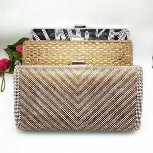 Three elegant evening clutch bags with geometric rhinestone patterns and metal clasps