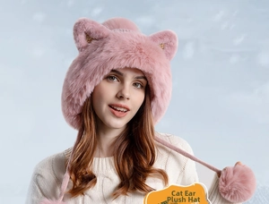 Close-up of pink knit hat with sequined cat ears and soft faux fur pom-pom ties