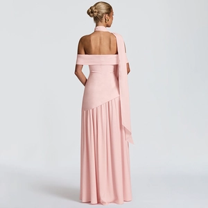 Detail of pink off-shoulder dress featuring pleated fabric, open back and long ribbon