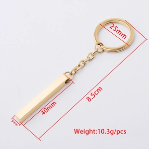 Polished gold rectangular bar keychain with measurements on a clean white background